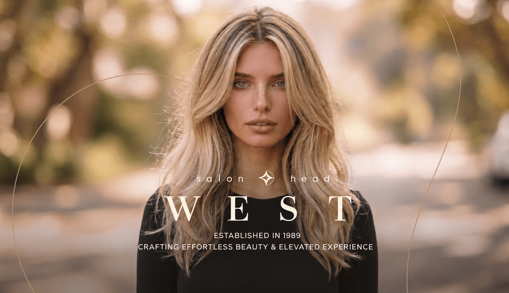 Salon Head West — established in 1989. Crafting effortless beauty and elevated experience. Blonde hairstyle in warm autumn light.